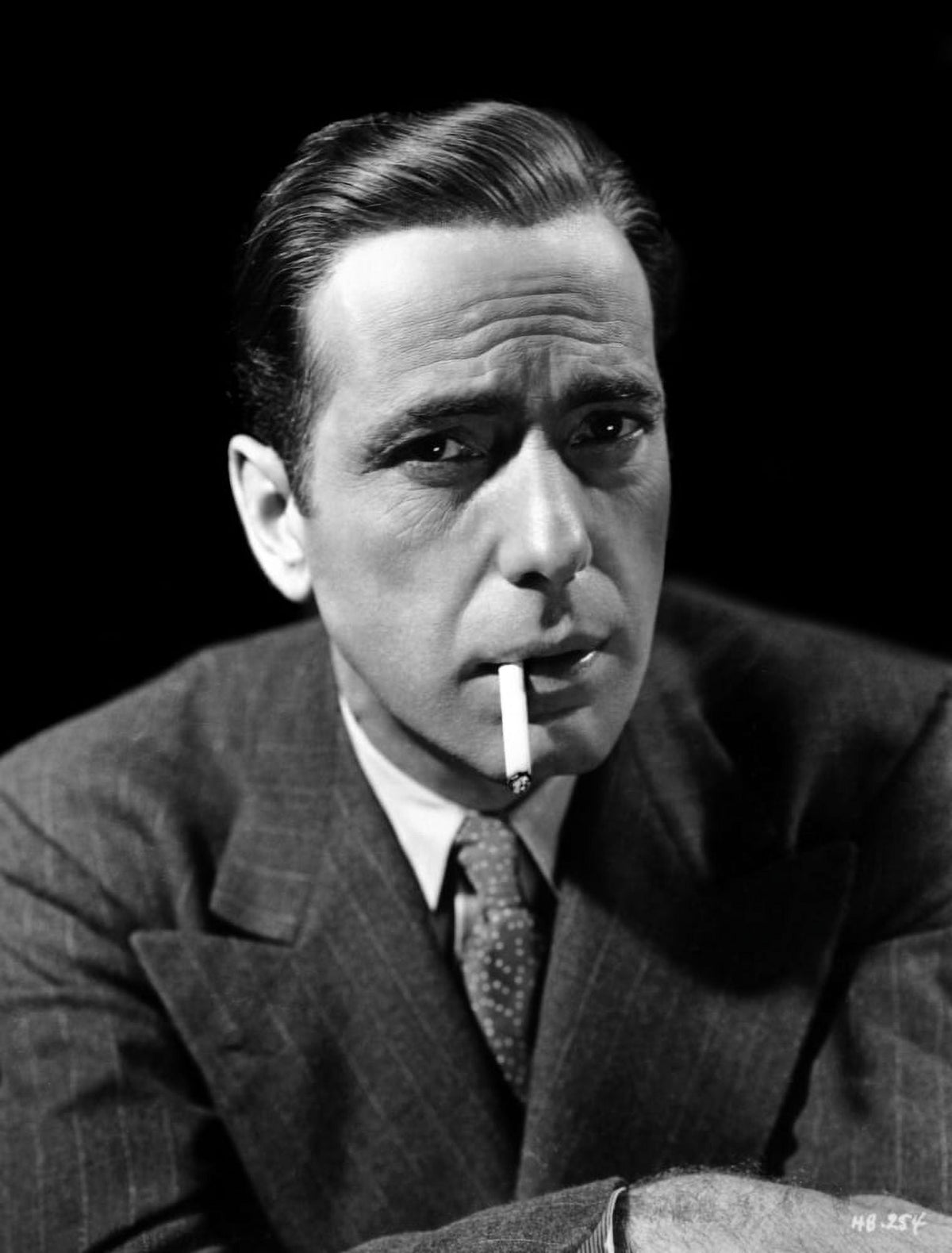 Humphrey Bogart photo print with cigarette in suit, classic Hollywood art.