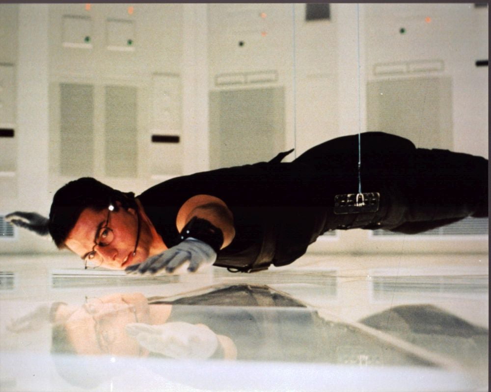 Tom Cruise suspended above floor in Mission: Impossible photo print.