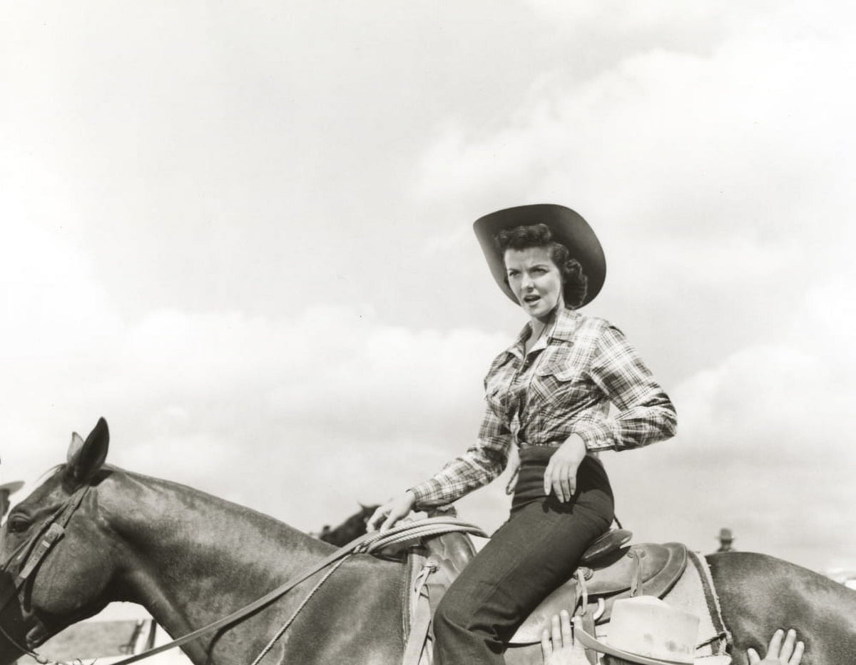 Black and white photo print of Jane Russell riding a horse.