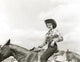 Black and white photo print of Jane Russell riding a horse.