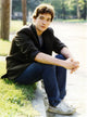 John Cusack sitting on the sidewalk photo print.