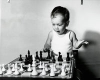 Close-up of a Boy Playing Chess Fine Art Print