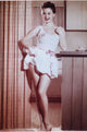 Mitzi Gaynor Pulling Up Dress Photo Print - Premium Quality