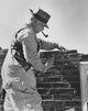 Senior Man Laying Bricks Fine Art Print - Side Profile View