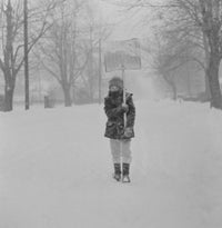 Boy with Snow Shovel in Blizzard Fine Art Print
