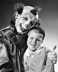 Clown Hugging a Boy and Smiling Fine Art Print