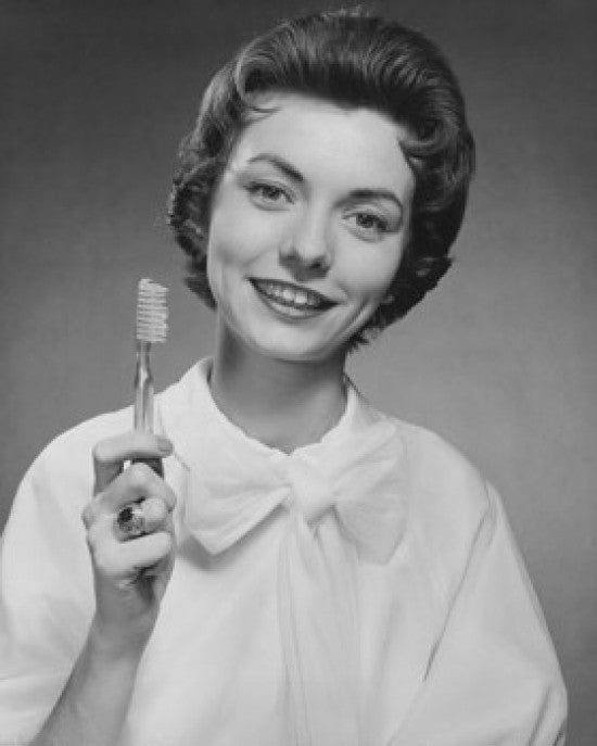Portrait of a Young Woman Holding a Toothbrush Fine Art Print