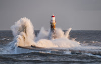 Waves Splashing Against Roker Lighthouse Fine Art Print by John Short