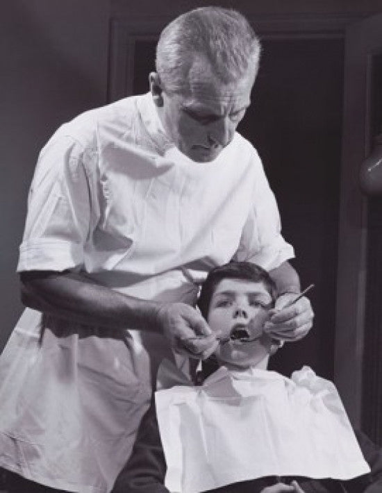 Male Dentist Examining a Boy's Teeth Fine Art Print
