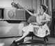 Young Woman Operating Air Conditioner Fine Art Print