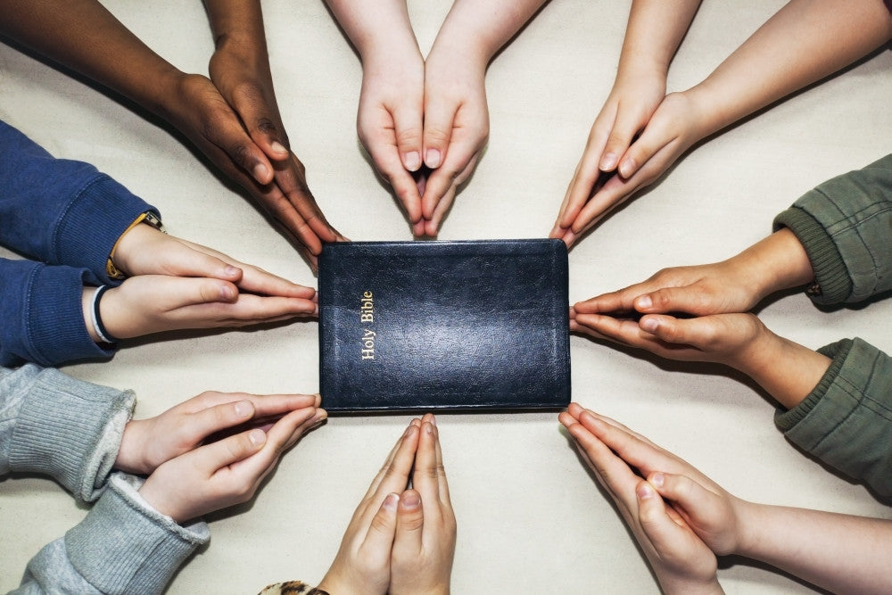 Praying Hands Pointing to a Bible Fine Art Print by Craig Tuttle
