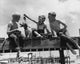 Low Angle View of Three Boys Fishing Fine Art Print