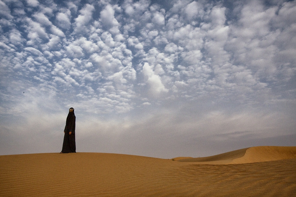 Bedouin Woman in the Desert Poster Print by Tom Norring