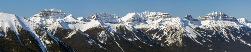 Panorama of Snow-Covered Mountains and Blue Sky - Banff, Alberta Fine Art Print by Michael Interisano