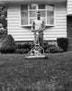 Young Man Cutting Grass with a Lawn Mower Fine Art Print