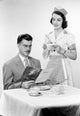 Waitress Serving Man at Restaurant Table Fine Art Print