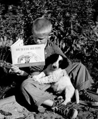 Boy Reading a Book with Dog Fine Art Print