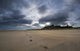 Footprints on the Beach with Bamburgh Castle Art Print by John Short