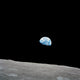 Earth Rising Above the Lunar Horizon Fine Art Print by Stocktrek Images