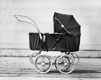Baby Carriage in Front of a Wall Fine Art Print