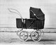Baby Carriage in Front of a Wall Fine Art Print