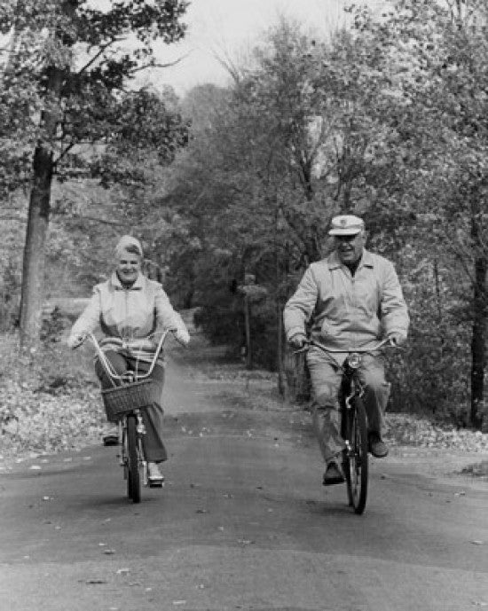 Senior Couple Riding Bicycles Fine Art Print