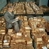 Side Profile of a Mature Man Counting Gold Bars Fine Art Print