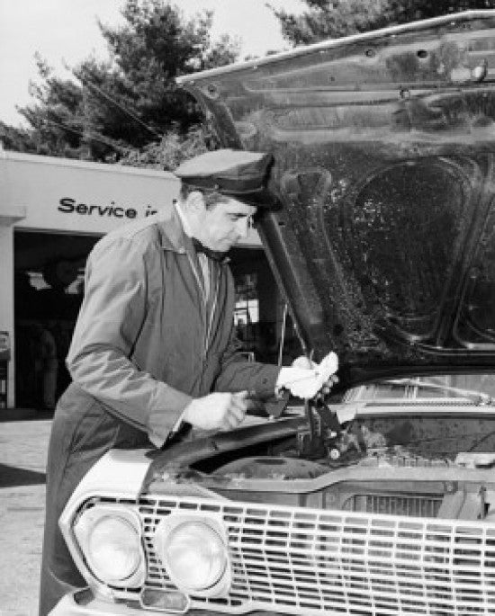 Auto Mechanic Repairing Car at Service Station Fine Art Print