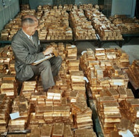 Side Profile of a Mature Man Counting Gold Bars Fine Art Print