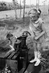 Boy Drinking Water as Girl Drinks – Fine Art Print