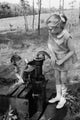 Boy Drinking Water as Girl Drinks – Fine Art Print