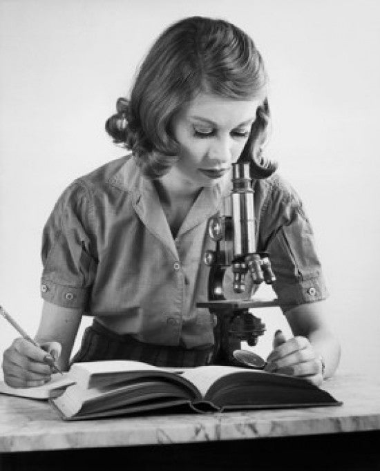 Teenage Girl Looking Through a Microscope Fine Art Print