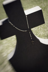 Rosary Draped Over A Gravestone Fine Art Print by Darren Greenwood