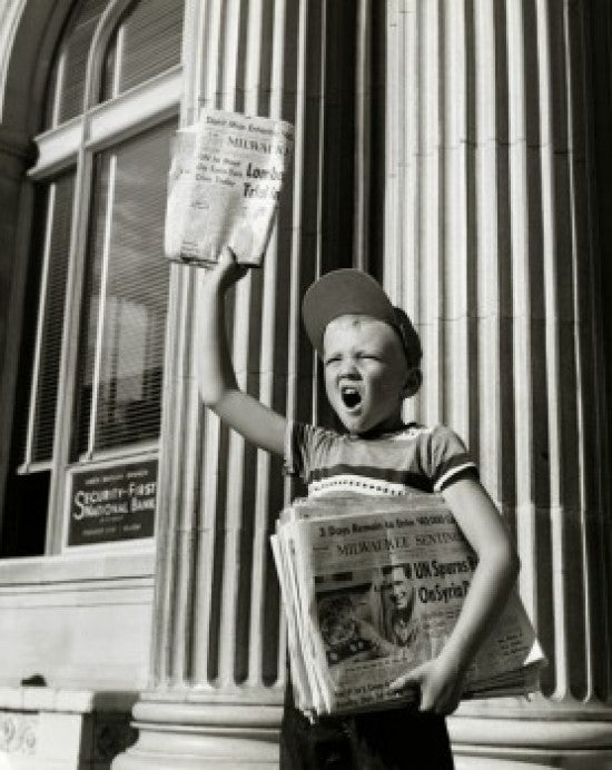 Boy Selling Newspapers in Front of a Building Fine Art Print