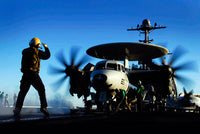 An Airman Guides an E-2C Hawkeye Fine Art Print by Stocktrek Images