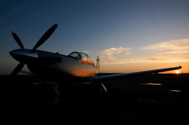 COB Speicher, Iraq - T-6 Texan Trainer Aircraft Poster Print by Terry Moore