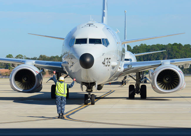 Aviation Electronics Technician Launching P-8A Poseidon Poster Print by Stocktrek Images