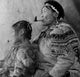 Mature Eskimo Man Smoking a Pipe with His Daughter Fine Art Print