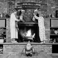 Charming Christmas Scene Poster Print - Kids Decorating Fireplace