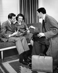 Side Profile of a Salesman Engaging with a Young Couple - Fine Art Print