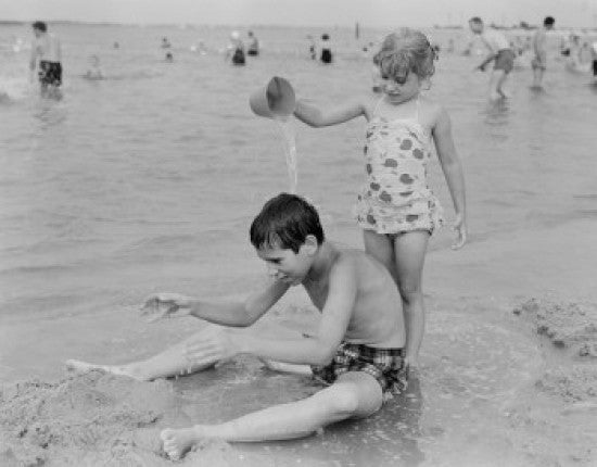 Sister Pouring Water on Brother at Beach Fine Art Print
