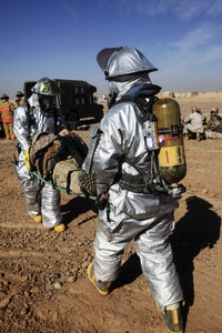 Firefighters Assisting Casualty at Camp Dwyer, Afghanistan Poster Print