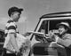 Young Man Buying a Newspaper from a Paper Delivery Boy Fine Art Print