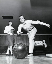 Young Man Bowling Fine Art Print with Woman in Alley
