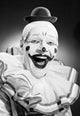 Studio Portrait of a Laughing Clown Fine Art Print