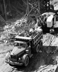 Excavator Loading Dirt into a Dump Truck Fine Art Print