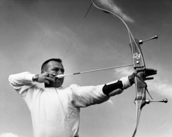 Mid Adult Man Aiming with a Bow and Arrow Fine Art Print