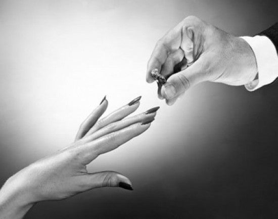 Man Placing Wedding Ring on Finger Fine Art Print