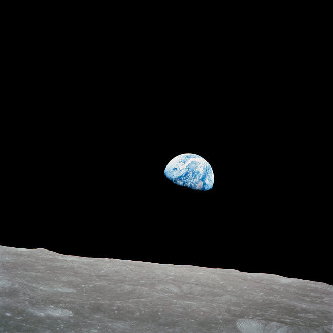 Earth Rising Above the Lunar Horizon Fine Art Print by Stocktrek Images