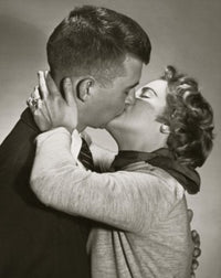 Side Profile of a Young Couple Kissing Fine Art Print